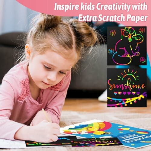 Child drawing on colorful scratch paper with creative designs.