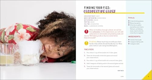 Child observing a fizzing science experiment with bubbles.