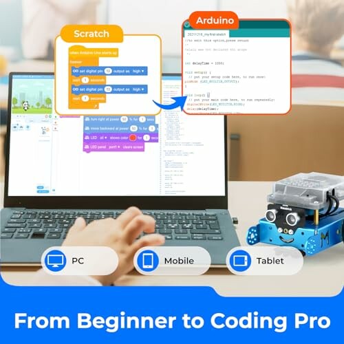 Child using a laptop with Scratch and Arduino coding interfaces, robot device on table.