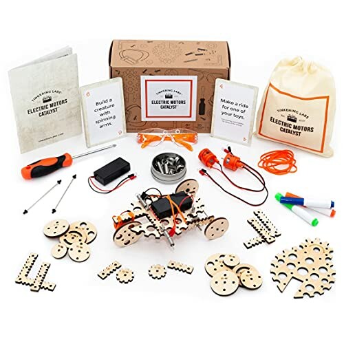 DIY electric motor kit with components and instruction manuals.