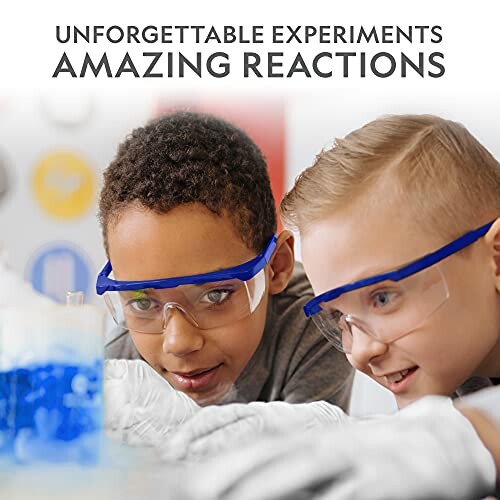 Two children wearing safety goggles conducting a science experiment with a blue liquid.