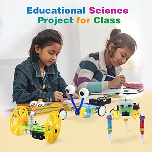 Two children working on educational science projects with small robotic models.
