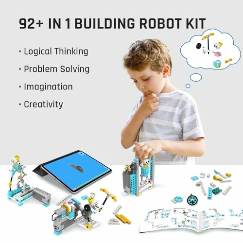 Child assembling a robot kit with tablet instructions.