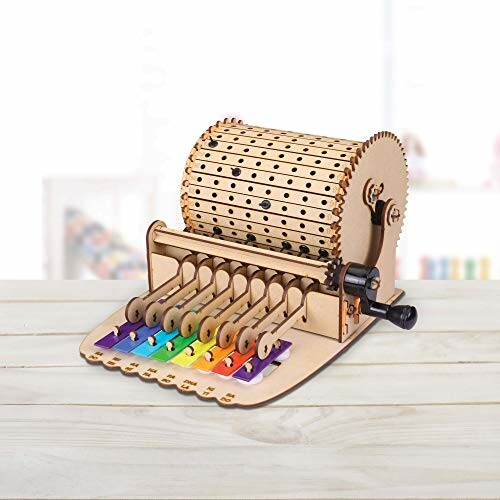 Wooden music box with a drum and colorful keys