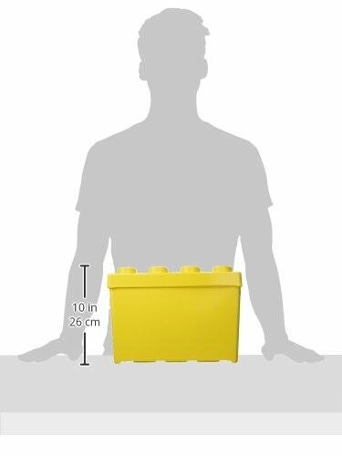 Yellow brick-shaped storage box next to silhouette for scale.